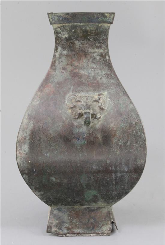 A Chinese archaic bronze wine vessel, Fanghu, Han dynasty, 3rd century B.C-3rd century A.D. , 34cm high, section of foot lacking